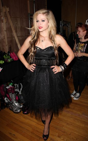 with a pair of black Converse AllStars Related Links Avril Lavigne