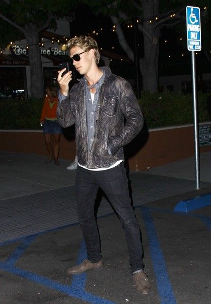 Boyfriend to Vanessa Hudgens and actor Austin Butler confronts the paparazzi as he films photographers on his iPhone and a friend argues with them as they leave a restaurant in Malibu
