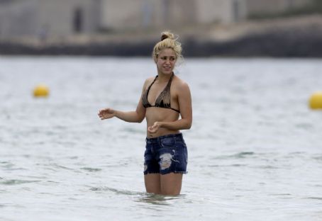 Shakira and her family on a beach in Ibiza, Spain