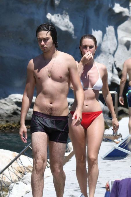 Grace Van Patten in White and Red Bikini at the beach in Ischia