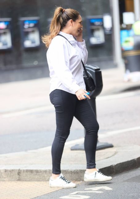 Kelly Brook – Seen in a white blouse and tight pants at Heart Radio in London