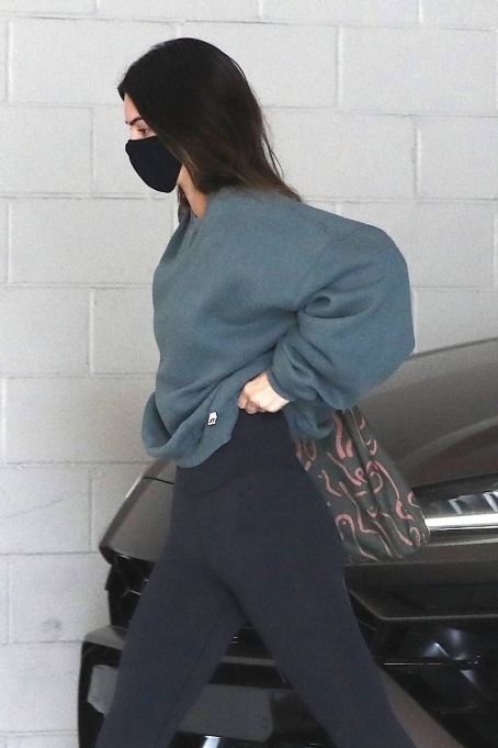 Kendall Jenner – Wearing black yoga pants and an oversized top in West Hollywood