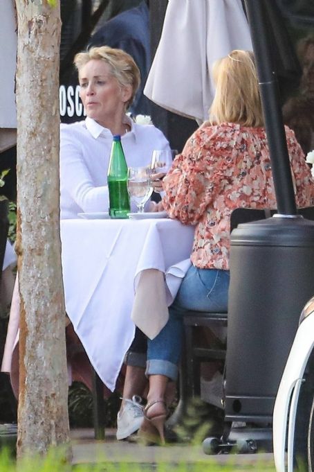Sharon Stone – Dons a pink blazer and matching pink purse at Toscana