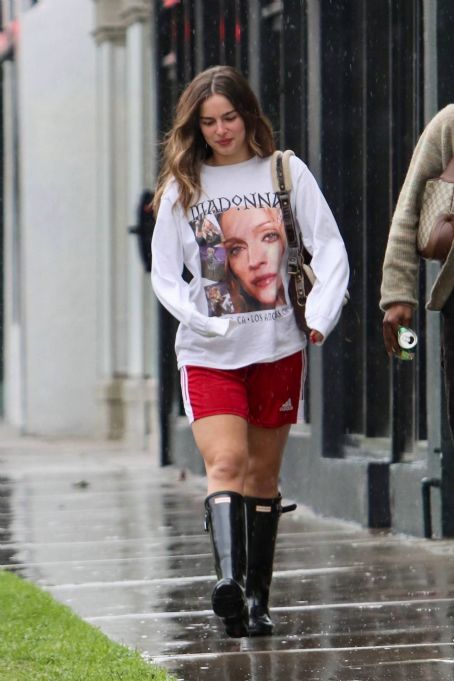 Addison Rae – In sports shorts and boots while splashing around West ...