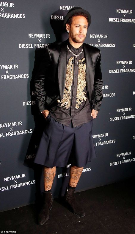 Neymar smoulders in a sleek black blazer, matching shorts and a gold-embellished shirt as he launches new Diesel fragrance