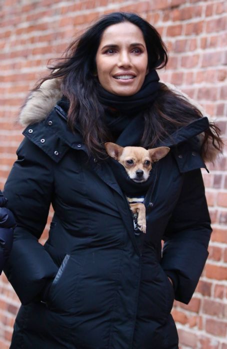 Padma Lakshmi – With her dog Divina warm inside her puffer jacket in New York