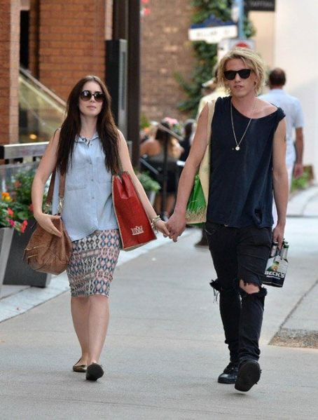 Lily Collins and her new boyfriend Jamie Campbell Bower walking in the ...