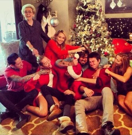 Miley Cyrus Shares Photo of 'Annual Family Fist Fight' on Christmas