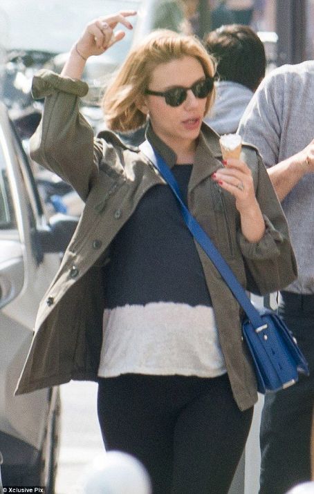 Scarlett Johansson enjoys an ice cream while showing off new haircut in Paris and a hint of a baby bump