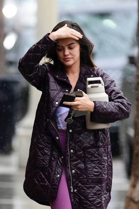 Lucy Hale – Braves the rain in Los Angeles
