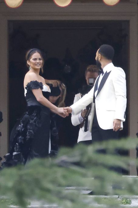 Chrissy Teigen – Pictured on the balcony of Villa Passalacqua in Como