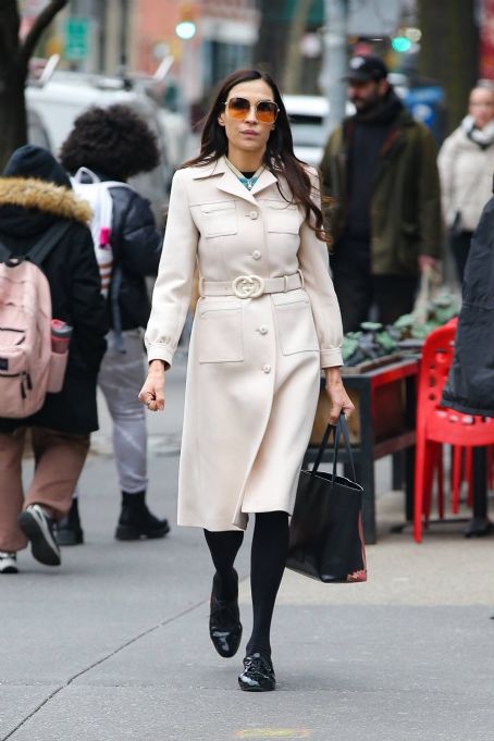 Famke Janssen – Dons a Gucci coat in New York