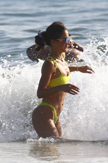 Camila Coelho stuns in yellow bikini while enjoying a beach day with  Alessandra Ambrosio in Santa