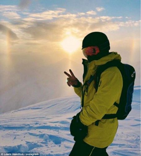 Lewis Hamilton poses in 'paradise' on 32nd birthday as F1 star shares snap on top of mountain in mystery location