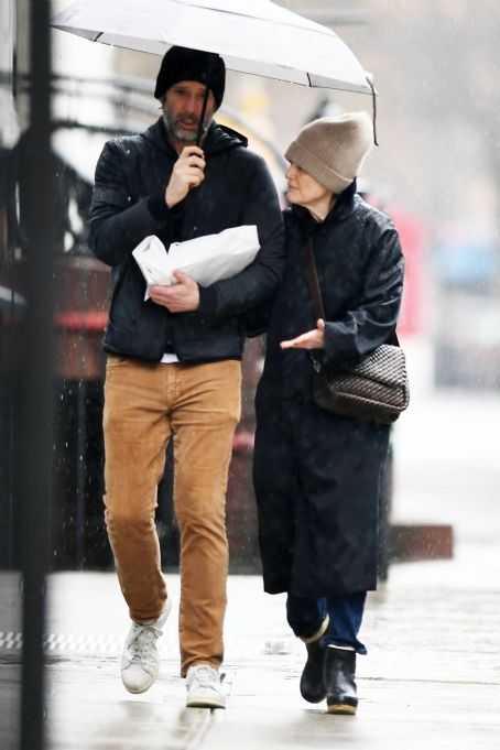 Julianne Moore – Seen Under an umbrella during a very rainy day in New ...