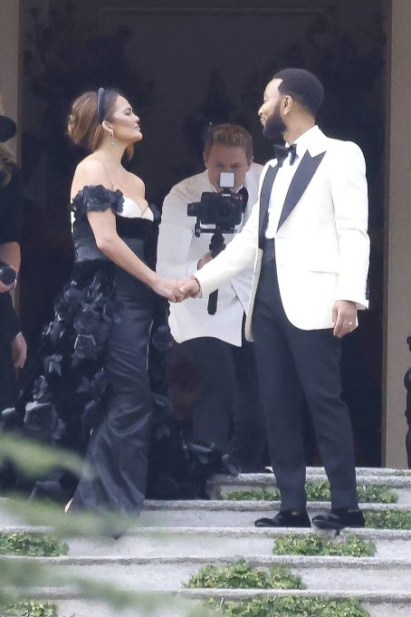 Chrissy Teigen – Pictured on the balcony of Villa Passalacqua in Como