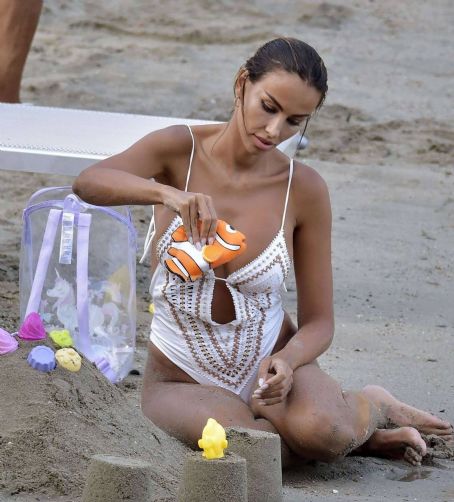 Madalina Diana Ghenea – In White Swimsuit at the Beach in Portofino