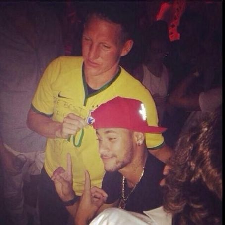 Bastian Schweinsteiger wearing a Neymar shirt and partying with the Brazilian star