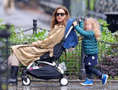 SHAYK-ING IT UP Irina Shayk takes it easy as daughter Lea pushes her around New York City in a pushchair