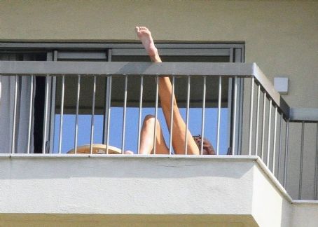 Luciana Gimenez – In a blue bikini on the balcony of her hotel in Rio de Janeiro