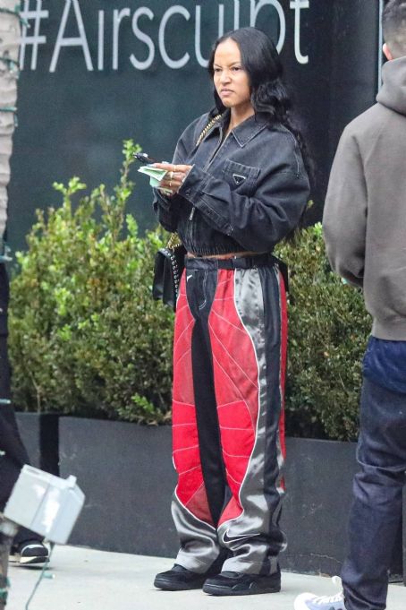 Karrueche Tran – In a baggy Nike track pants with her family at Jon and Vinny’s Pizza in LA