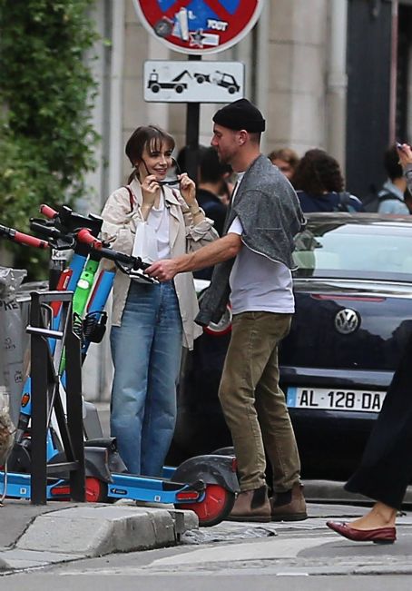 Lily Collins – With new boyfriend Charlie McDowell go for a ride in scooter in Paris