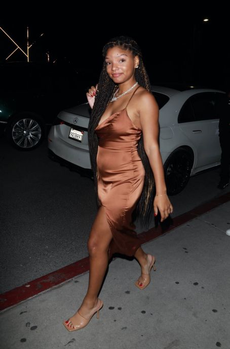 Halle Bailey – Leaving Catch Steak LA in a bronze dress in West Hollywood
