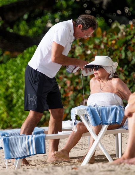 Joan Collins – With her husband Percy Gibson on their holidays in