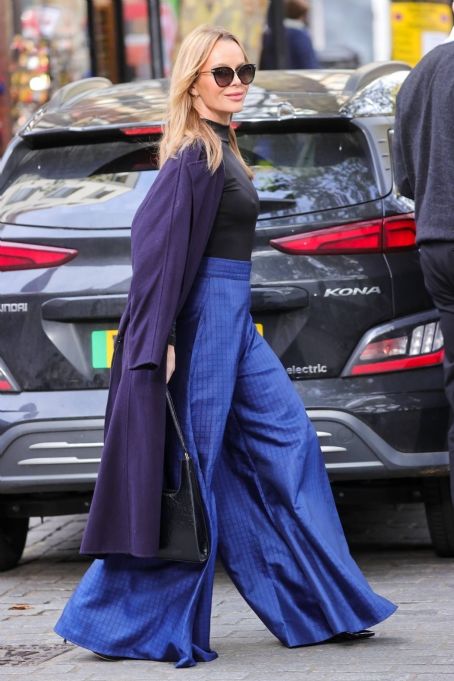 Amanda Holden – Wearing metallic blue flared trousers in London