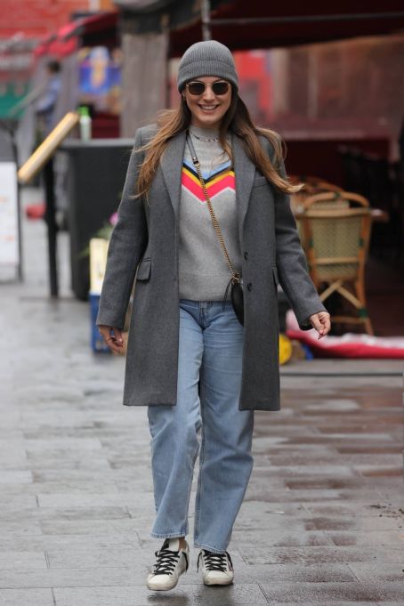 Kelly Brook – Wears festive jumper and faded denim jeans at Heart radio in London