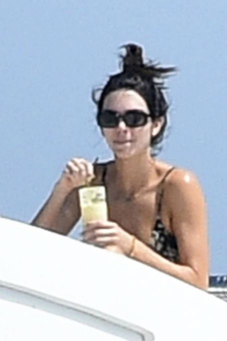 Kendall Jenner – Spotted in a bikini on a yacht in Sardinia